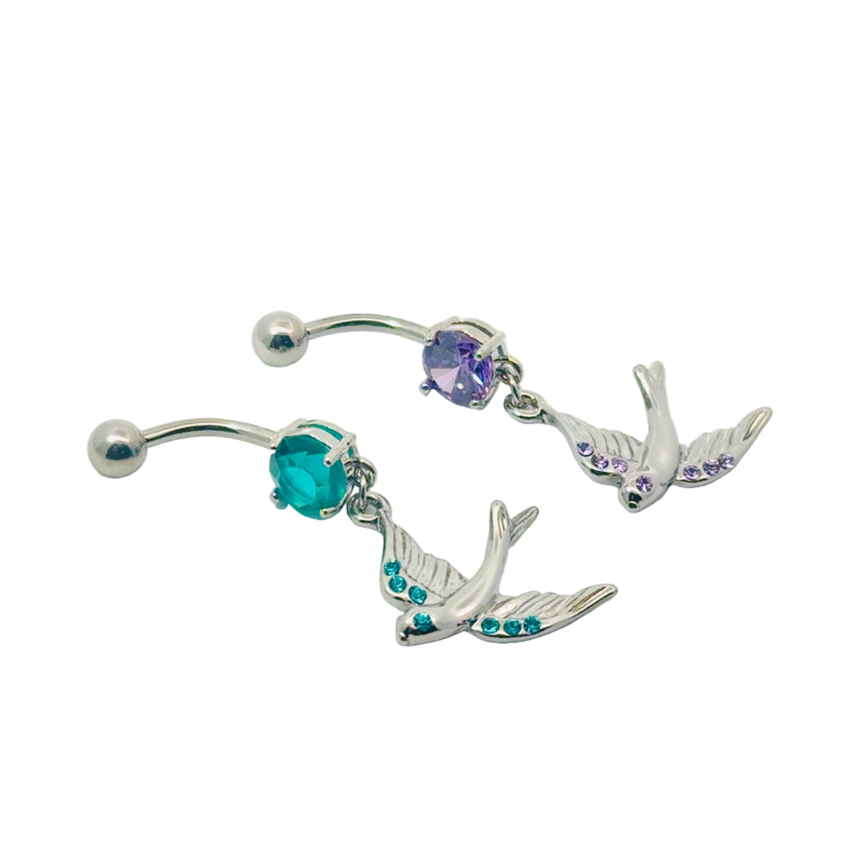 Silver belly button bars with bird charms and gemstones on a white background