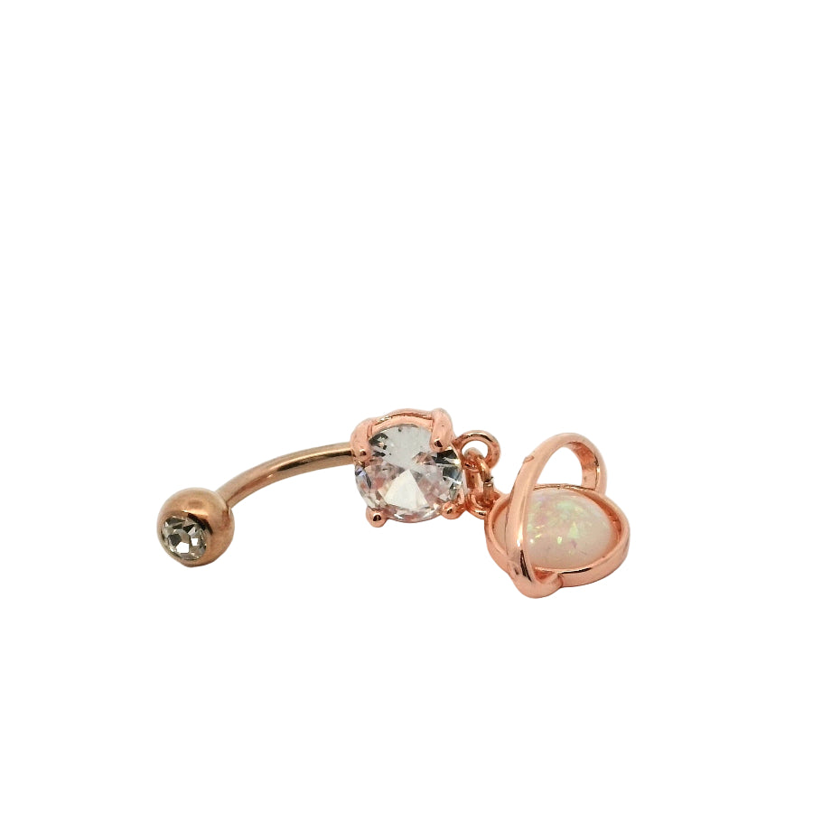 Rose gold belly button bar with gemstones on a white background