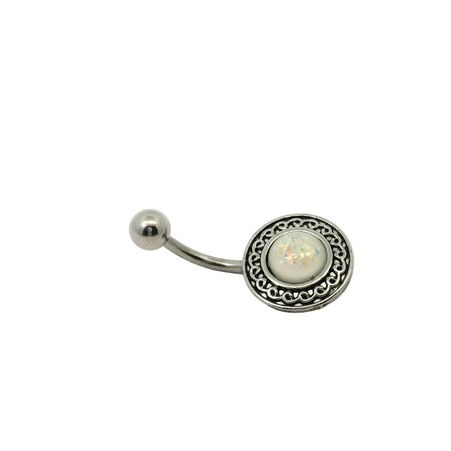Belly button bar with decorative metal band and gemstone on a white background