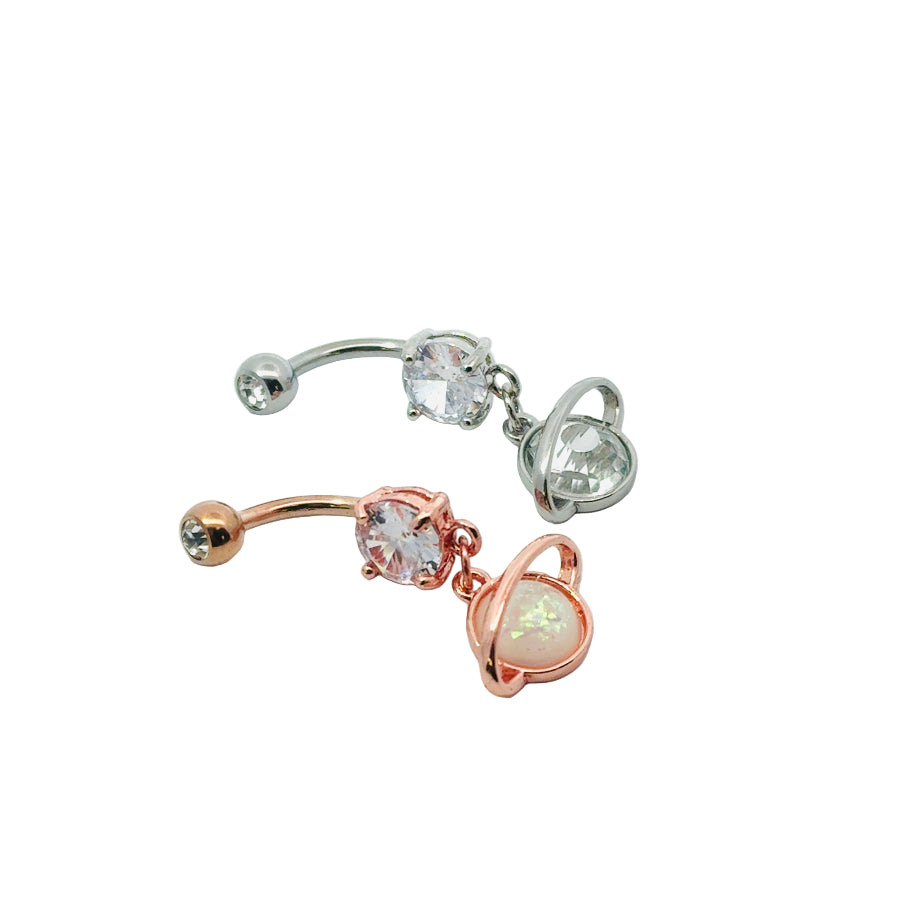 Rose gold and silver belly button bars with gemstones on a white background