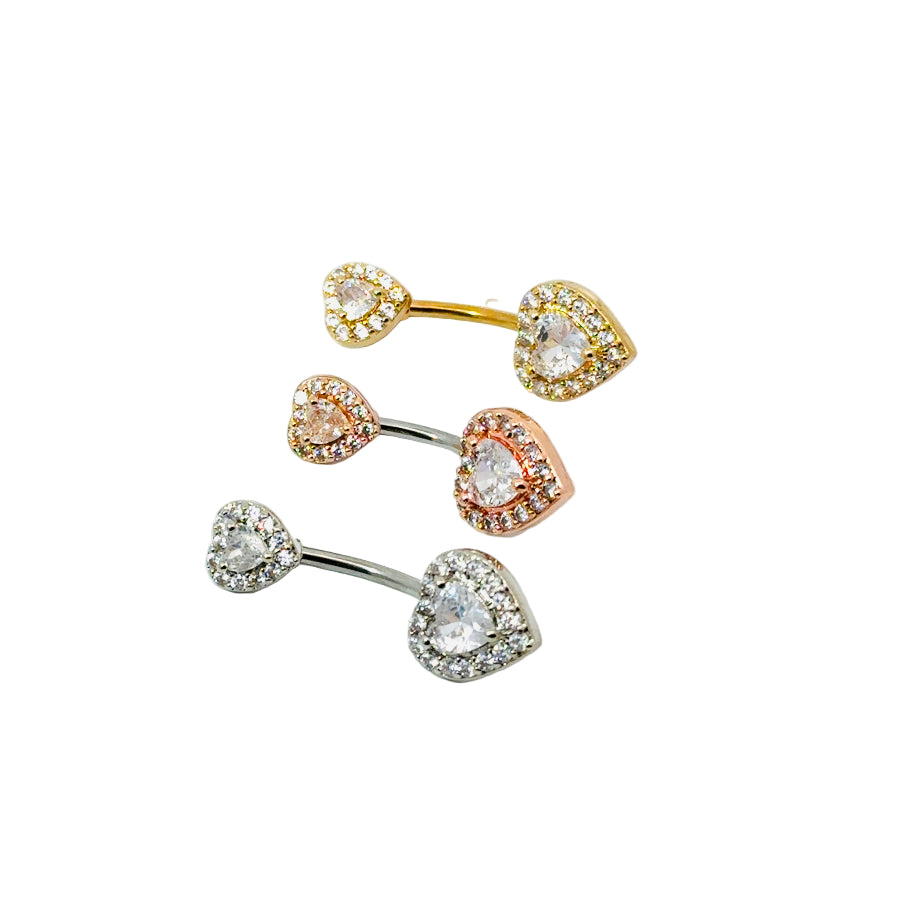 Set of gold, rose gold, and silver belly button bars with clear gemstones on a white background