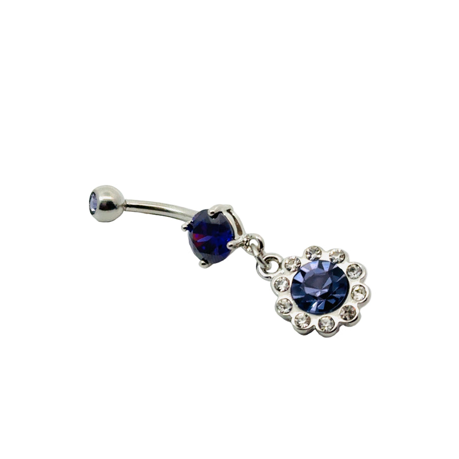 Belly button bar with blue gemstones on a white background
