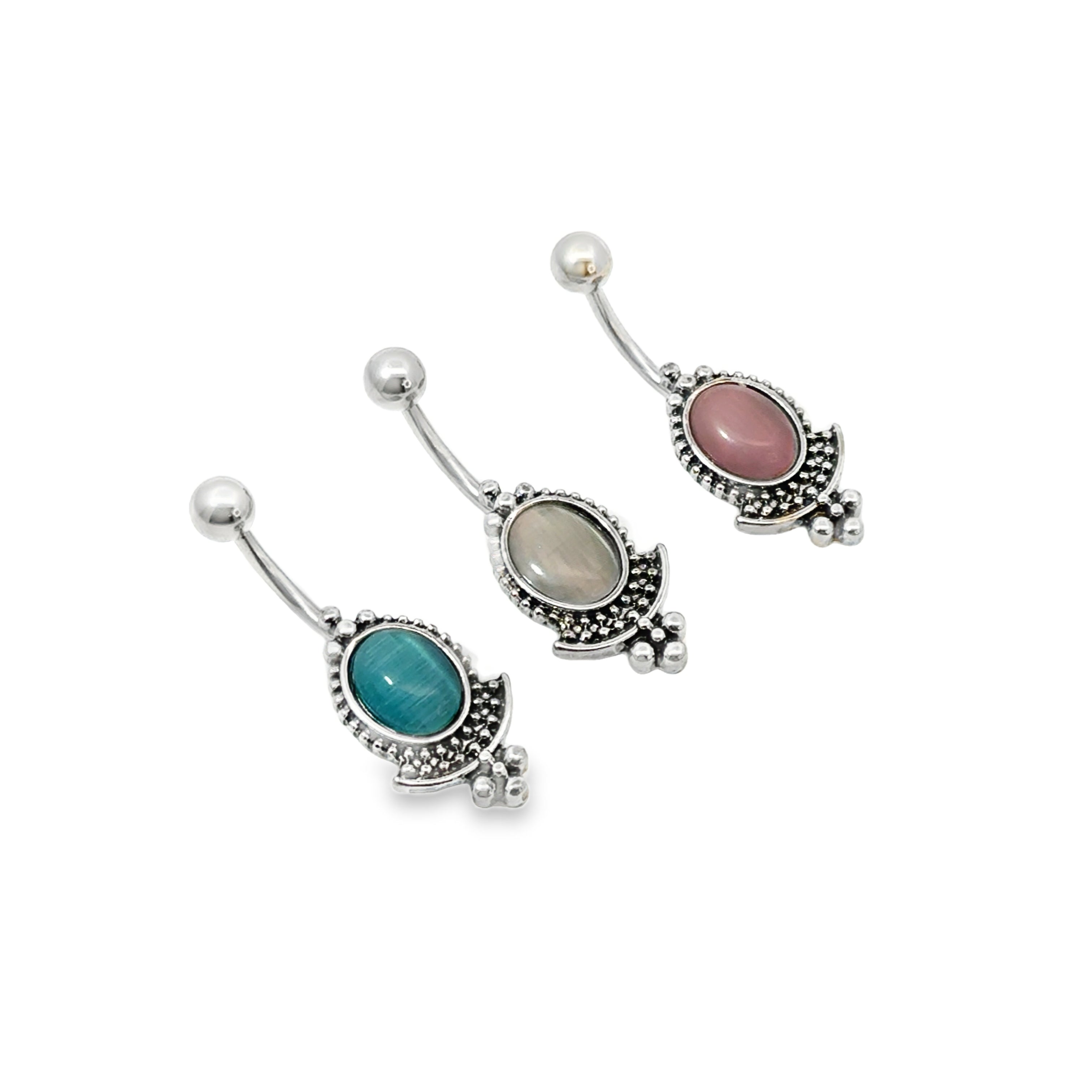 Two belly buttons with gemstones on a white background