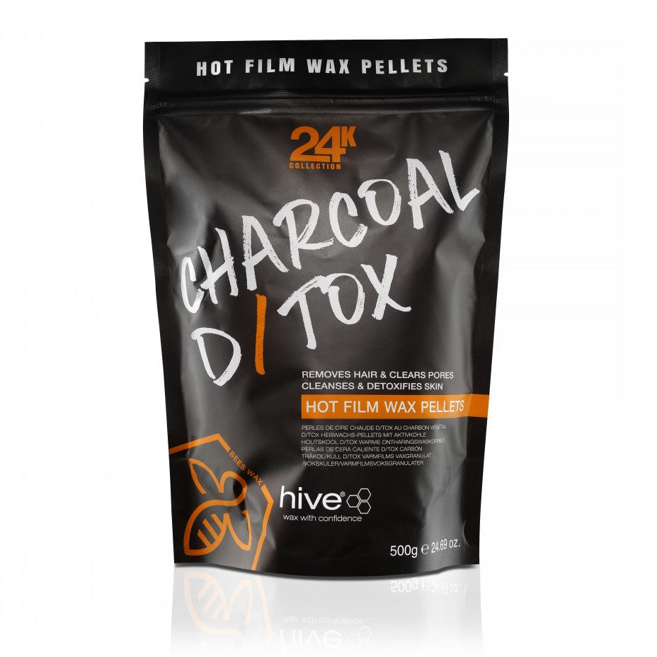 A black package of HIVE Charcoal Detox Hot Wax Pellets for sensitive skin waxing, with a resealable design and a label showing the product name and weight of 500g.