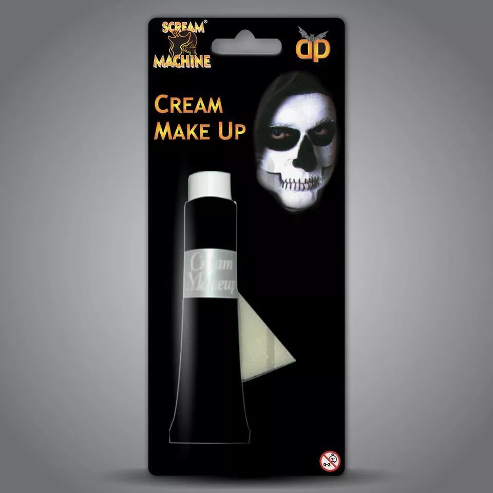 Packaging of cream makeup with a skull design on a gray background