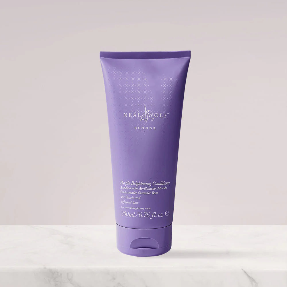 Purple tube of Neal & Wolf Blonde Purely Brightening Conditioner on a white background