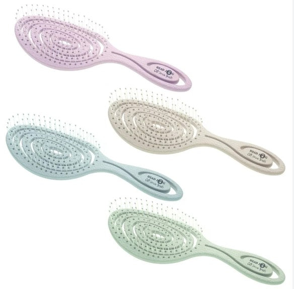 set of 4 pastel coloured hairbrushes on a white background