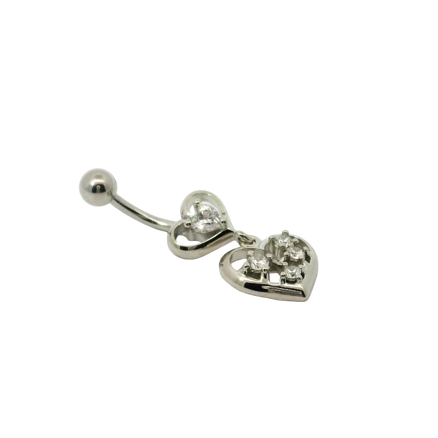 Heart-shaped navel bar with clear gemstones on a light pink background