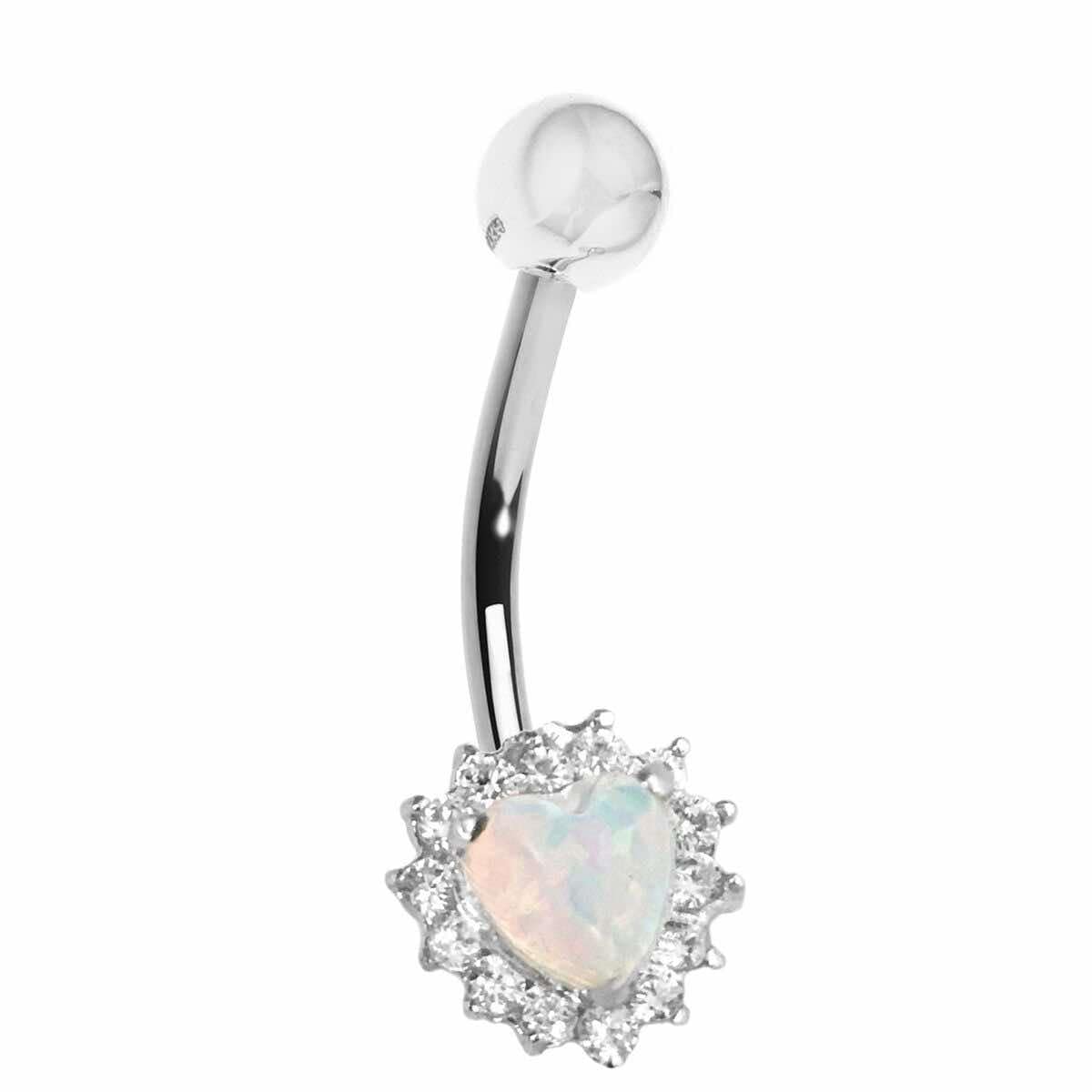 A belly button bar with a white crystal heart-shaped top and mini gem accents on the bar.