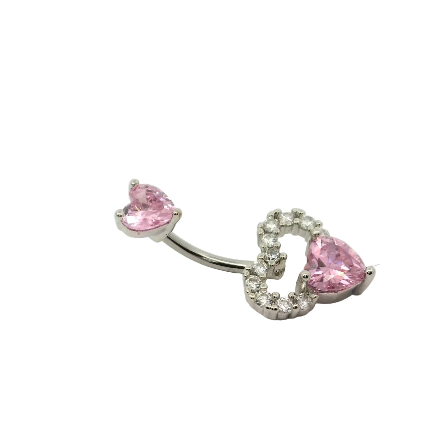 Silver navel bar with heart shaped pink gem on a white background