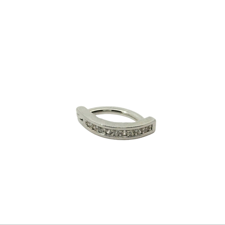 Silver navel ring with small stones on a white background