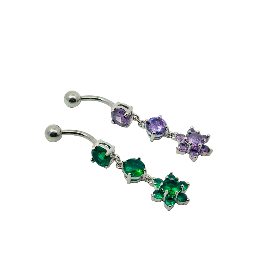 Silver belly button bars with green and purple gemstones on a white background
