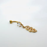 Gold belly button ring with crystal embellishments on a white background