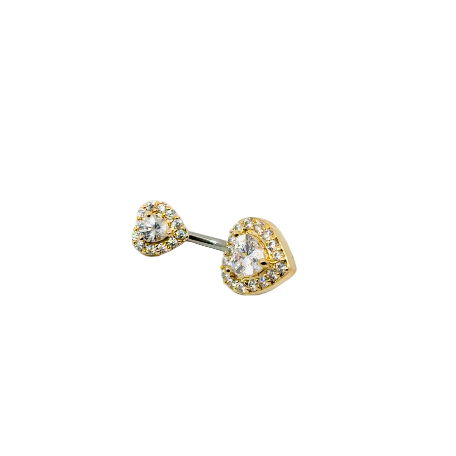 Gold and silver heart-shaped navel bar on a white background