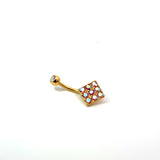 Gold belly button ring with colorful gemstones on a white background