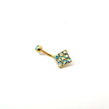 Gold belly button ring with colorful gemstones on a white background