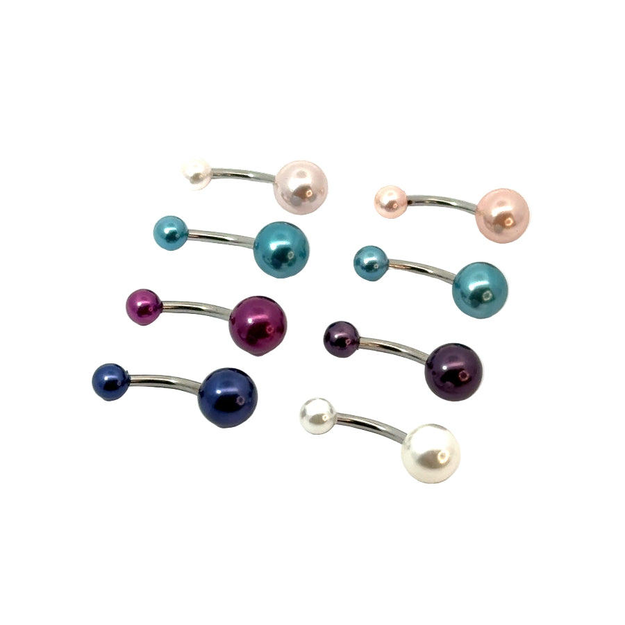 Set of colorful belly button rings on a white background