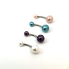 Set of belly buttons with colored beads on a white background