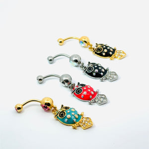 Set of colorful owl-shaped belly buttons on a white background