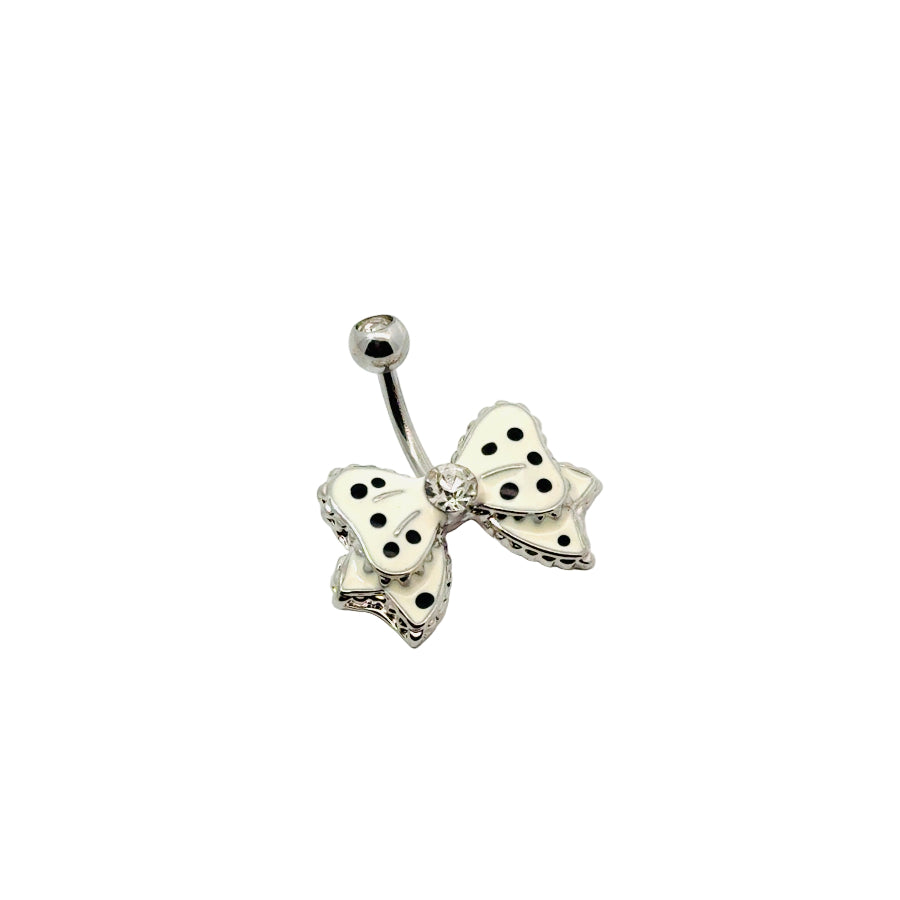 Silver bow-shaped belly button bar with black polka dots on a white background