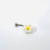 Belly button ring with a daisy flower design on a white background