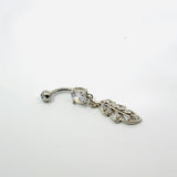 Silver belly button ring with clear gemstones on a white background