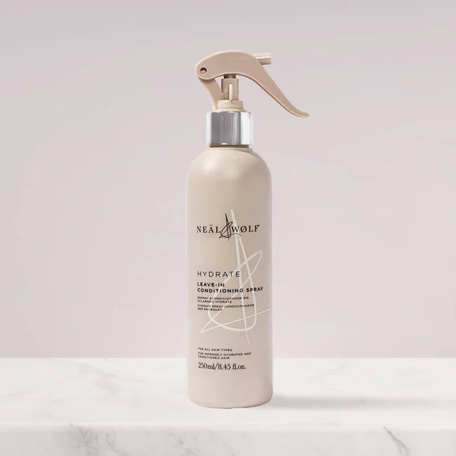 Neal & Wolf leave-in conditioning spray bottle on a light background