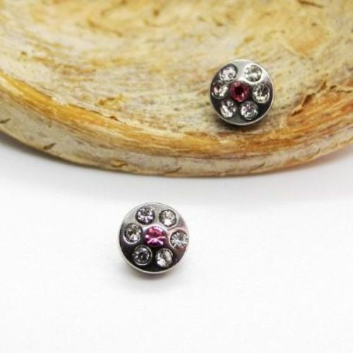 Dermal Crystal topper laid on a wooden background
