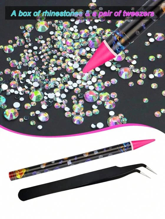 Box of rhinestones and a pair of tweezers on a black surface with pink accents.
