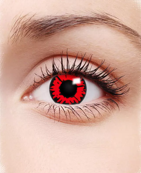 Close-up of an eye with a red and black contact lens