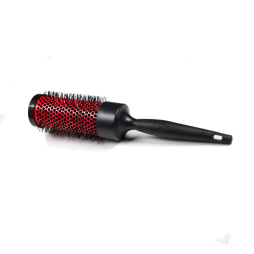 Hairbrush with red bristle head and black handle on a white background