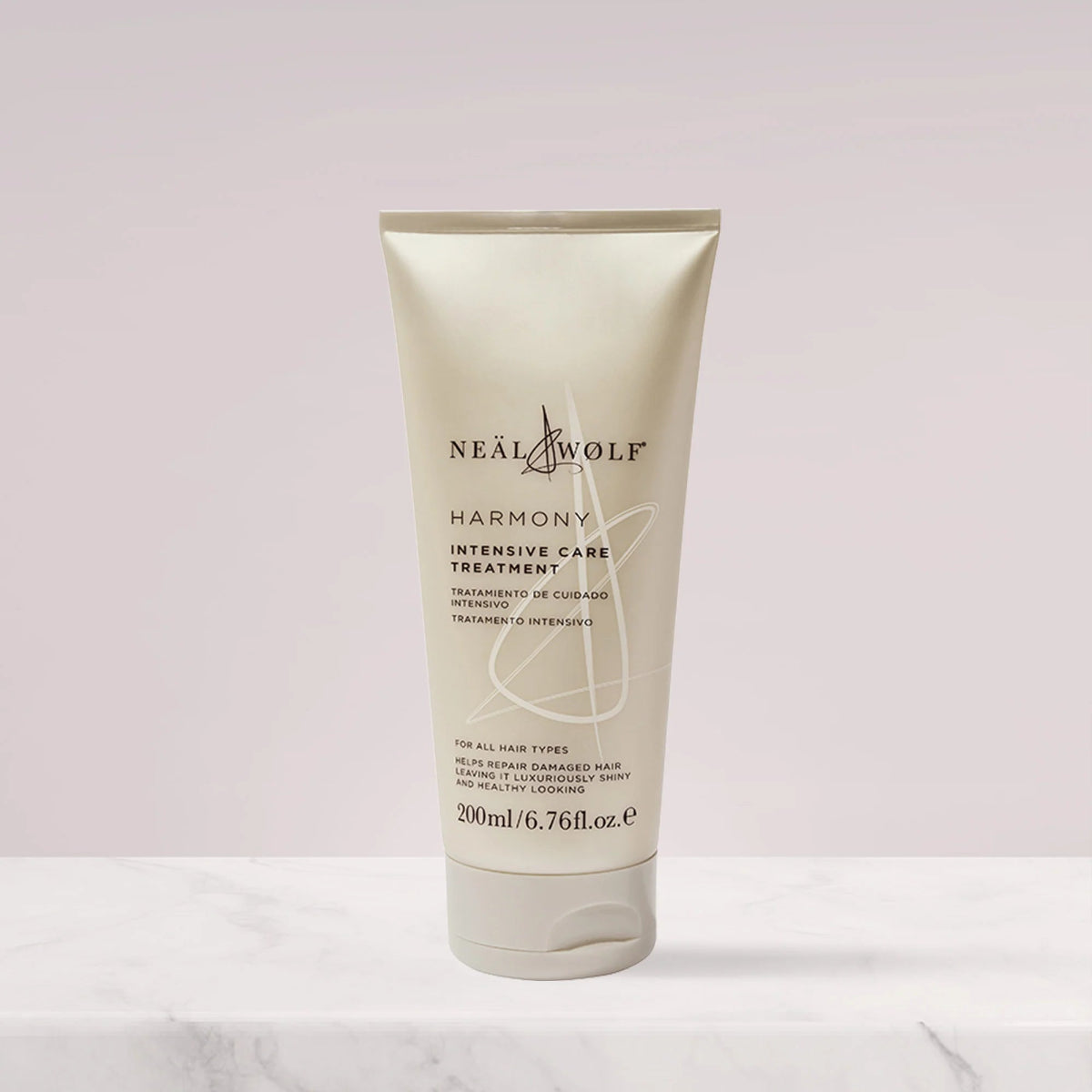 Tube of Neal & Wolf Harmony Intensive Care Treatment on a light pink background