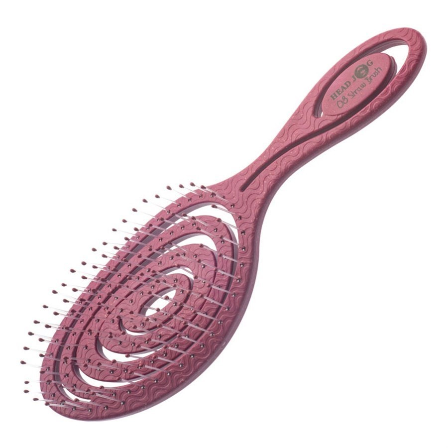 deep pink coloured hair brush on a white background