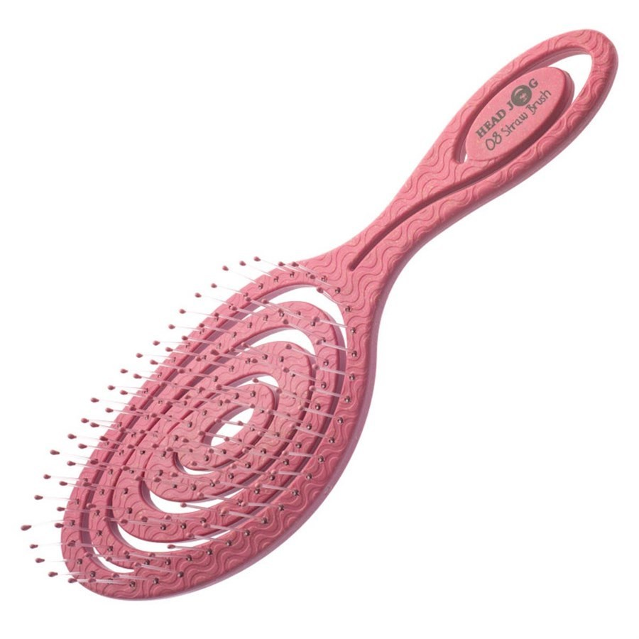 salmon pink hairbrush on a white background