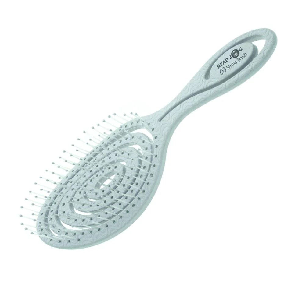 mint coloured headjog branded hair brush on a white background