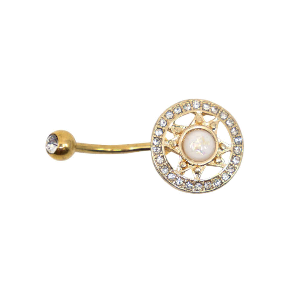 Gold round ornaate navel bar on a white background