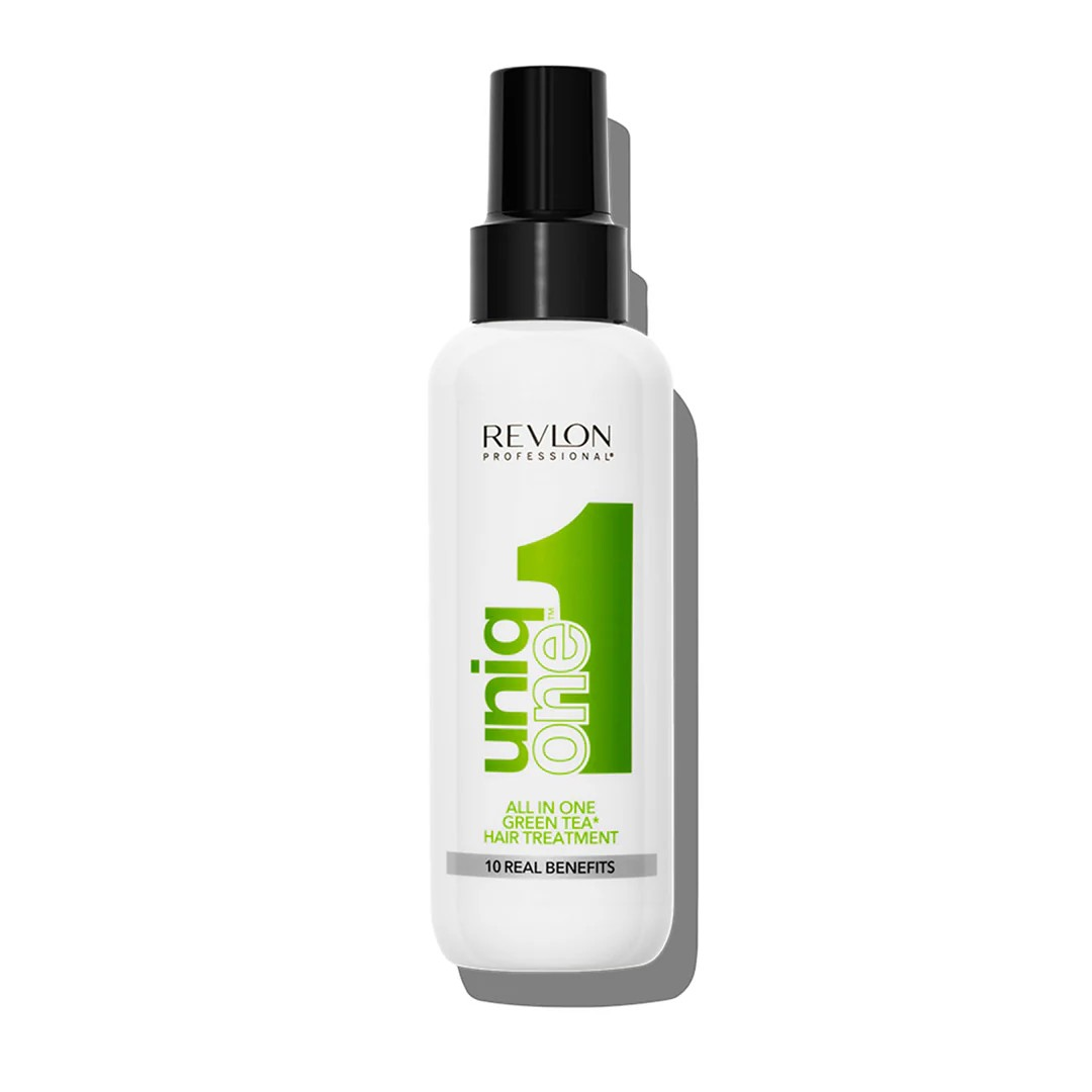a bottle of revlon uniqone tea tree spray with a black pump top