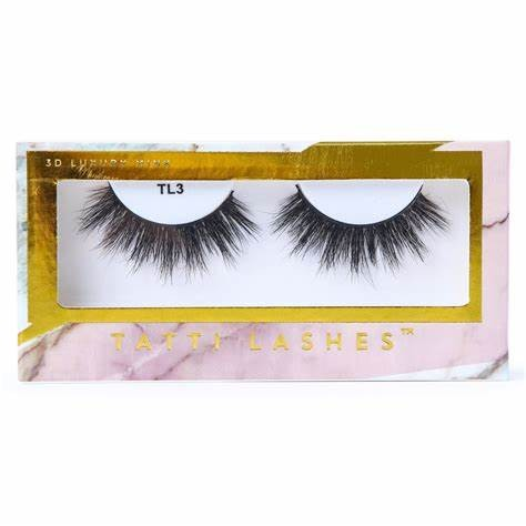 box of tatti lash branded eye lash strips in their packaging on a white background