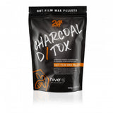 A black package of HIVE Charcoal Detox Hot Wax Pellets for sensitive skin waxing, with a resealable design and a label showing the product name and weight of 500g.